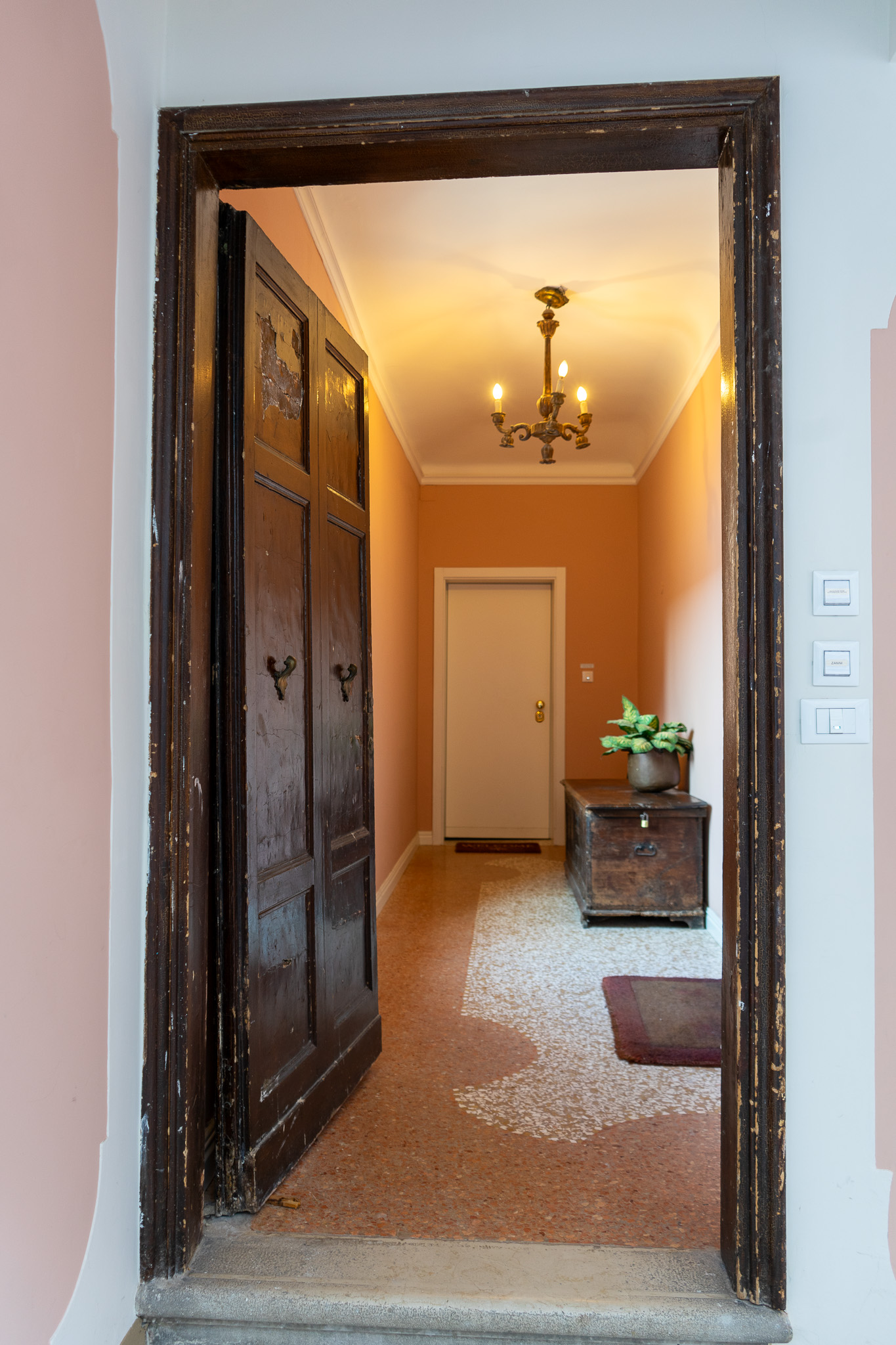 Entrance corridor with ancient wooden door